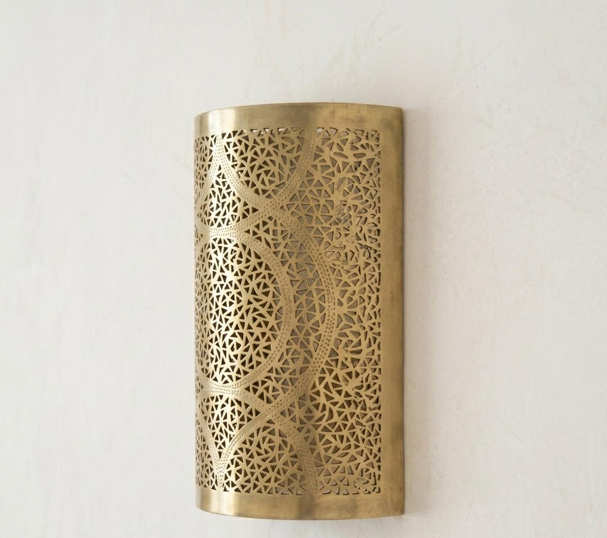 Handmade Moroccan Brass Cylinder Wall Sconce – Pierced Geometric Wall Light with Circular Arabesque Pattern, Warm Golden Glow and Dramatic Shadow Projection