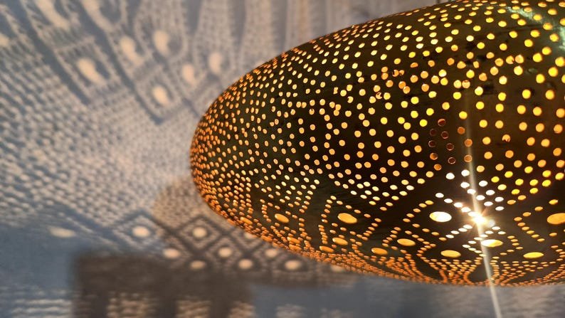 Moroccan Brass Pendant Light: Hammered Lantern with Intricate Shadow Pattern Moroccan Brass Pendant Light: Hammered Lantern with Intricate Shadow Pattern