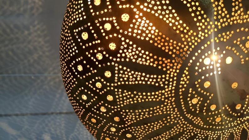 Moroccan Brass Pendant Light: Hammered Lantern with Intricate Shadow Pattern Moroccan Brass Pendant Light: Hammered Lantern with Intricate Shadow Pattern